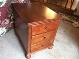 Three-drawer end table with bun feet