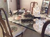 Glass top dining table, six needlepoint seat Queen Anne chairs, decorative accessories 