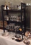 A collection of Antique Etched Glass, Crystal Goblets, Larchman Pewter, Silverplate in the dining room