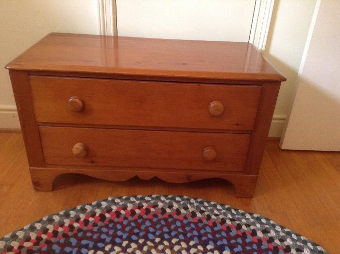 Low two drawer dresser. Matches other bedroom furniture.