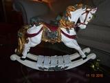 Hand painted cast rocking horse, part of collector porcelain dolls measures 17" long x 15" high x 5" deep
