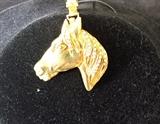 18K Y/G WITH DIAMONDS HORSE PENDANT WITH .31 CARATS OF DIAMONDS SIGNED BY OCTAVIO SARDA