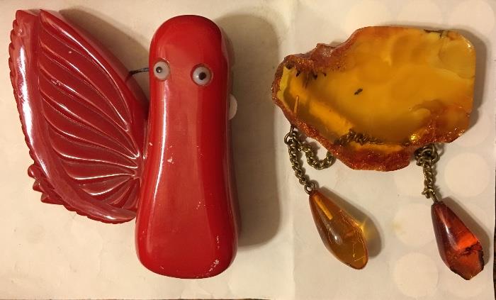Some Bakelite  pelican lipstick holder and amber chain brooch 
