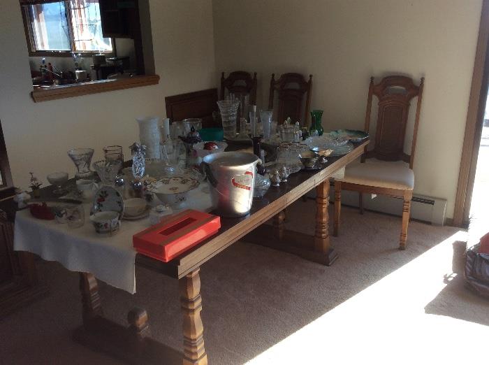 Glassware, serving, dining table and chairs
