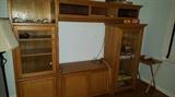 WALL UNIT NEEDS REPAIR ON DOOR 125