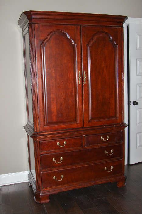 American Drew Armoire. Doors fold all the way to the side. 