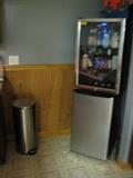 Wine fridge, apartment size fridge and chrome trashcan