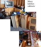 Many kitchen cabinets and light fixtures
