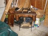 Vintage Singer sewing machine in cabinet