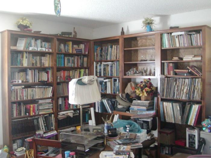 books and more books,  section of Louis L'amour paperbacks mostly, some are first and second edition, Golden books for children, sets of books and novels, old hard back readers digest, one section is just fly fishing, section of albums and 45's 