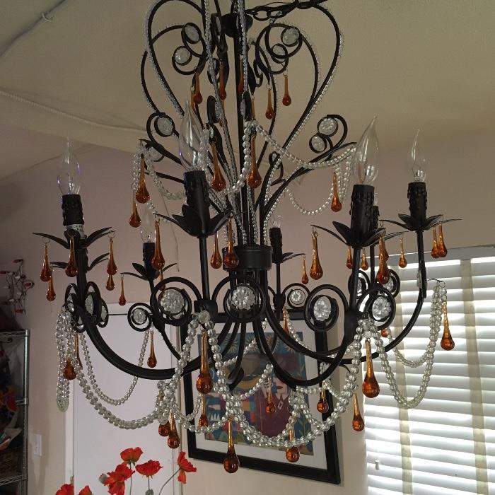 The a two of these cool chandelier... And although they have shades, we kind of like um naked