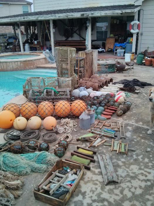 Nautical items; ship lanterns, fishing nets, glass fishing balls, lobster traps, eel traps, many, many items from North of the Arctic Circle.  Many fish nets with numerous glass fishing balls attached. 