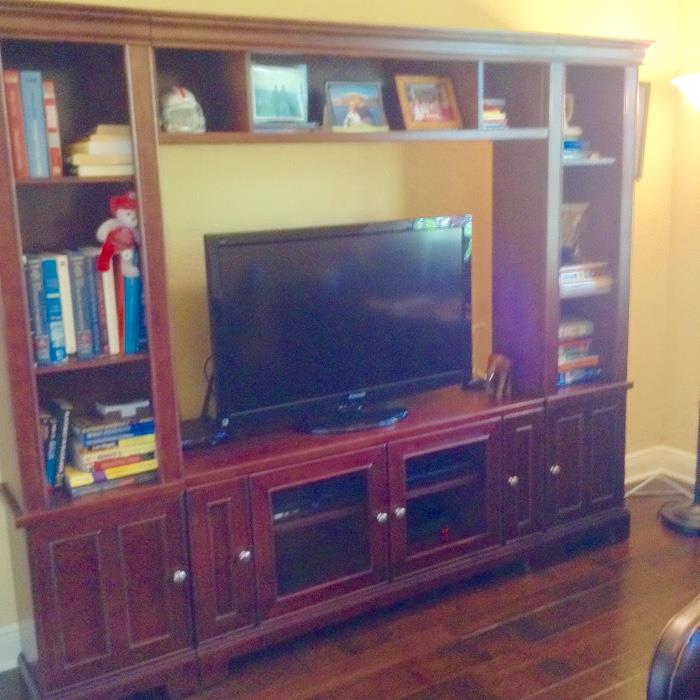 Beautiful entertainment center will hold a 54" by 36" flat screen 