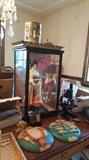 Porcelain doll purchased in China in the 1980s, several other items from their travels in China, Africa, and Europe for sale. Also pictured, vintage microscope, religious wall hangings....