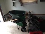 Wheelbarrow, spreader, hose with caddy