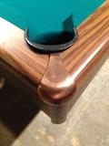 Copper detail on pool table.