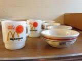 McDonald's mugs by Fire King, 1950s, and International House of Pancakes cereal bowls.