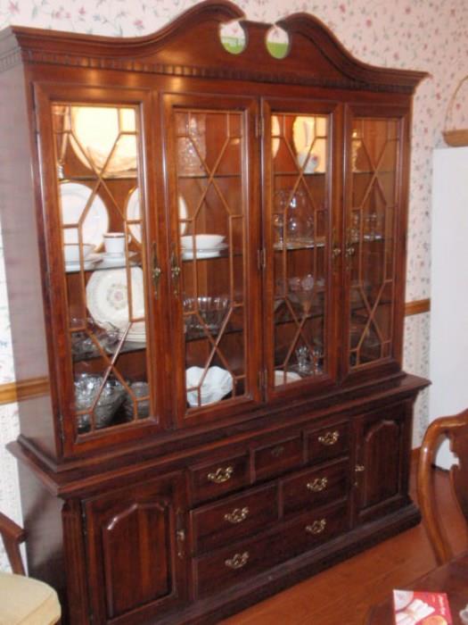 Thomasville China Cabinet with glass shelves and lighted.