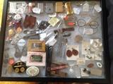 World War I uniform buttons, knives, lighters, political buttons, jewerly.