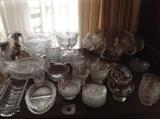 Clear glassware different styles and sizes.  Unique pieces can be found on every table at this sale.