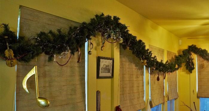 Music themed garland goes all the way around the east side of the home