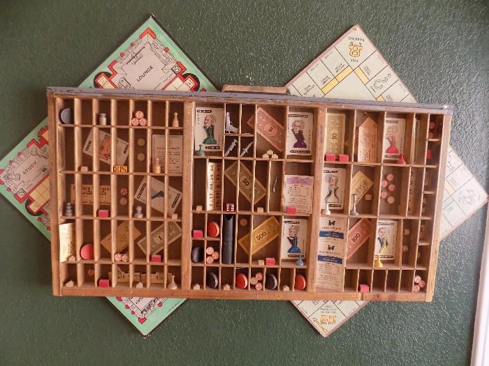 Antique printers tray with old game boards and pieces...made into wall hanging