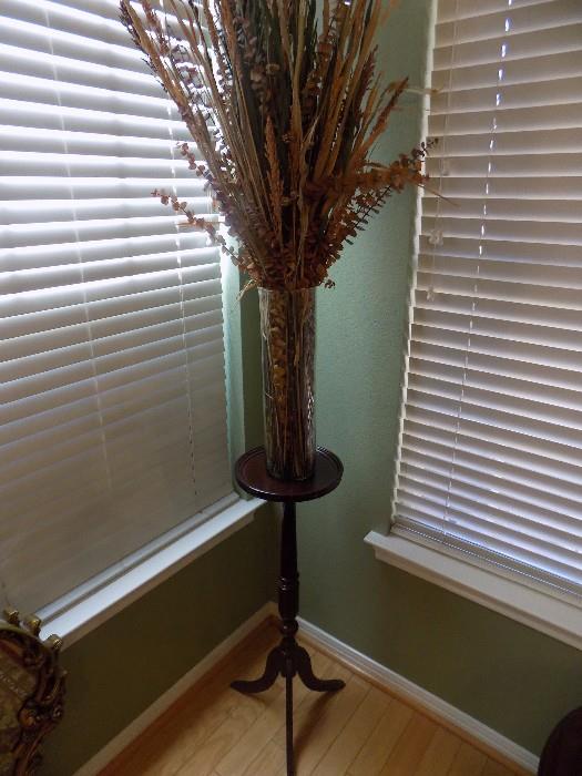 plant stand and floral arrangement