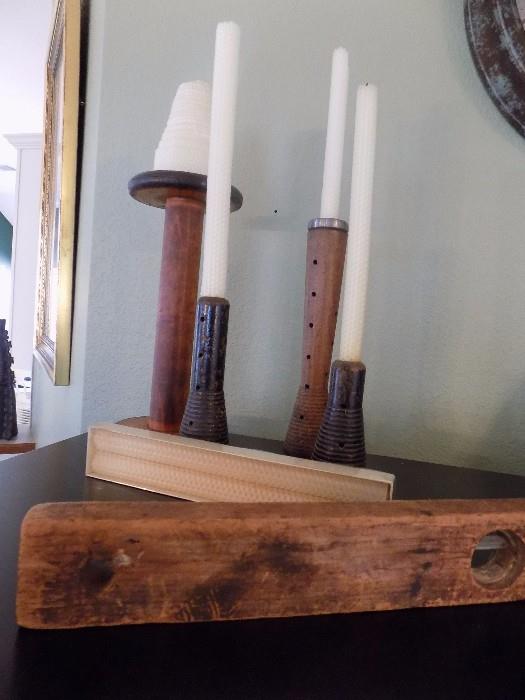 spool candlesticks, bees wax candles, and old wooden level