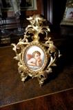 Hand Painted Porcelain Cherub with Gilt Wood Frame