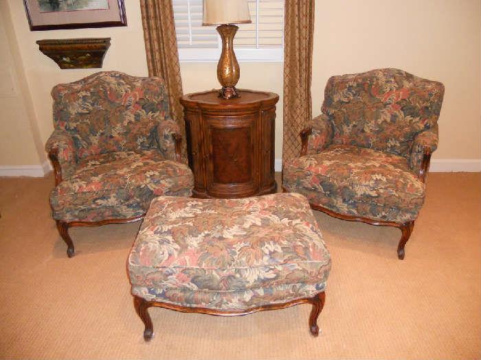 Pair of chairs with ottomans