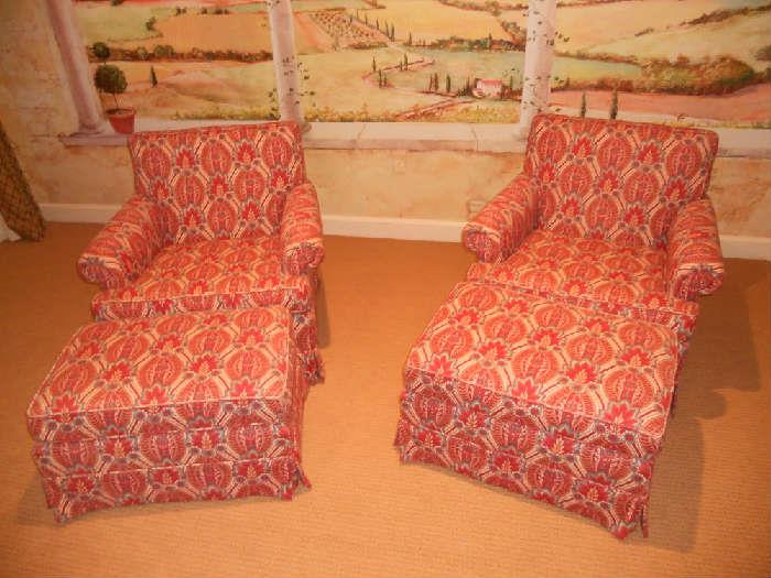 Pair of club chairs with ottomans