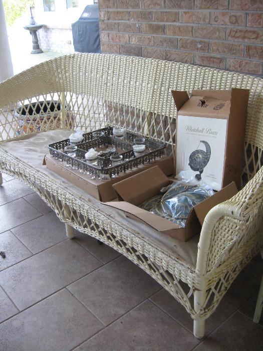 Large sturdy good quality wicker sofa with matching chair and rocker. 