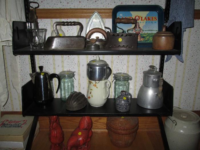 Irons, Wooden Butter Mold, hand crank egg beater,crocks and coffee pots.