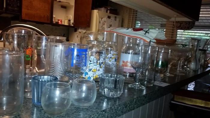 Misc glassware, including various UT mugs, Sapporo beer mugs.