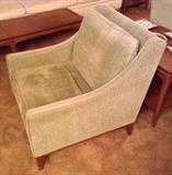 One of a pair of mod green armchairs by Brandrud. Full disclosure: both are sun faded & have "crunchy" foam cushions.