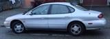For sale: 1998 Ford Taurus SE - 4 door sedan, automatic transmission, 174K miles. Electric locks, AM/FM/CD player.  