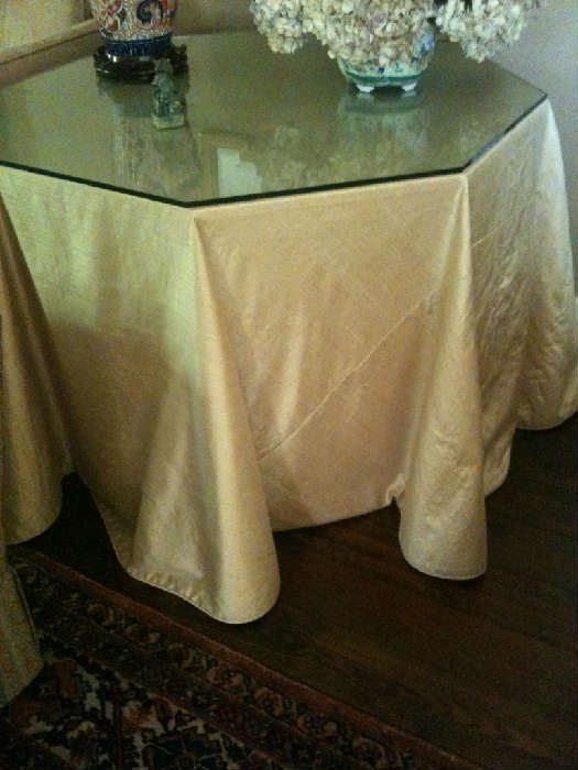 numerous decorator tables with custom skirts and glass tops