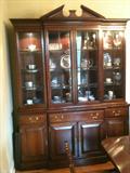 Mahogany breakfront/china cabinet by Link Taylor, in perfect condition, with locks and original paperwork. Matching Pedestal table with leaves and 8 chippendale style mahogany chairs.