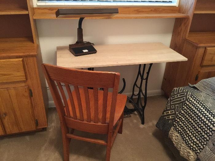 Desk made from vintage sewing machine base with marble top