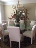 gorgeous 6 foot round glass top table with 6 chairs, and the gorgeous china cabinet behind it!!!  From a lovely home in Chenal!!!