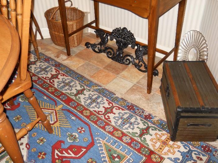 Kazak rug, child's trunk, cast iron ornamentation, primitive desk w/1 drawer, etc.