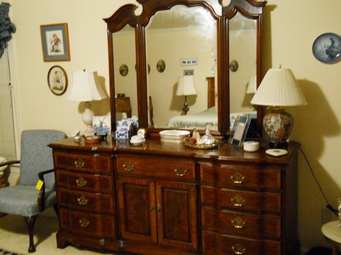 dresser with adjustable mirrors, lamps, hair receiver, perfume bottles, etc.