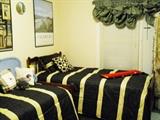 twin bed, pool cue in box, etc.