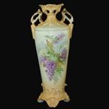 Antique double handle Urn Vase, Beautifully hand painted porcelain vase with purple and white lilacs with gold trim. Makers Mark Unclear, possibly Nippon
Condition:Good
Shipping: Yes
Size: 11"
