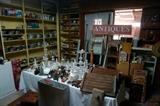Tons of old cast iron, cookware, signs, two chandeliers, old wooden boxes, meat grinders, railroad nails.