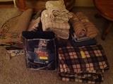 Assorted linens, queen and twin sheet sets and duvets, assorted floor rugs
