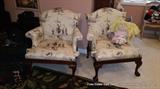 Pair of black and white upholstered arm chairs