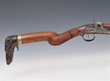 Lot 244: Percussion Rifle with Dog Head, Continental
walnut stock with 34" barrel, mid-19th century BID ON-LINE: www.fairfieldauction.com