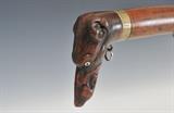 Lot 244: Percussion Rifle with Dog Head, Continental
walnut stock with 34" barrel, mid-19th century BID ON-LINE: www.fairfieldauction.com