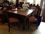 Antique Dining Room Set with 4 chairs and 4 leafs. Cushion covering are brand New!
